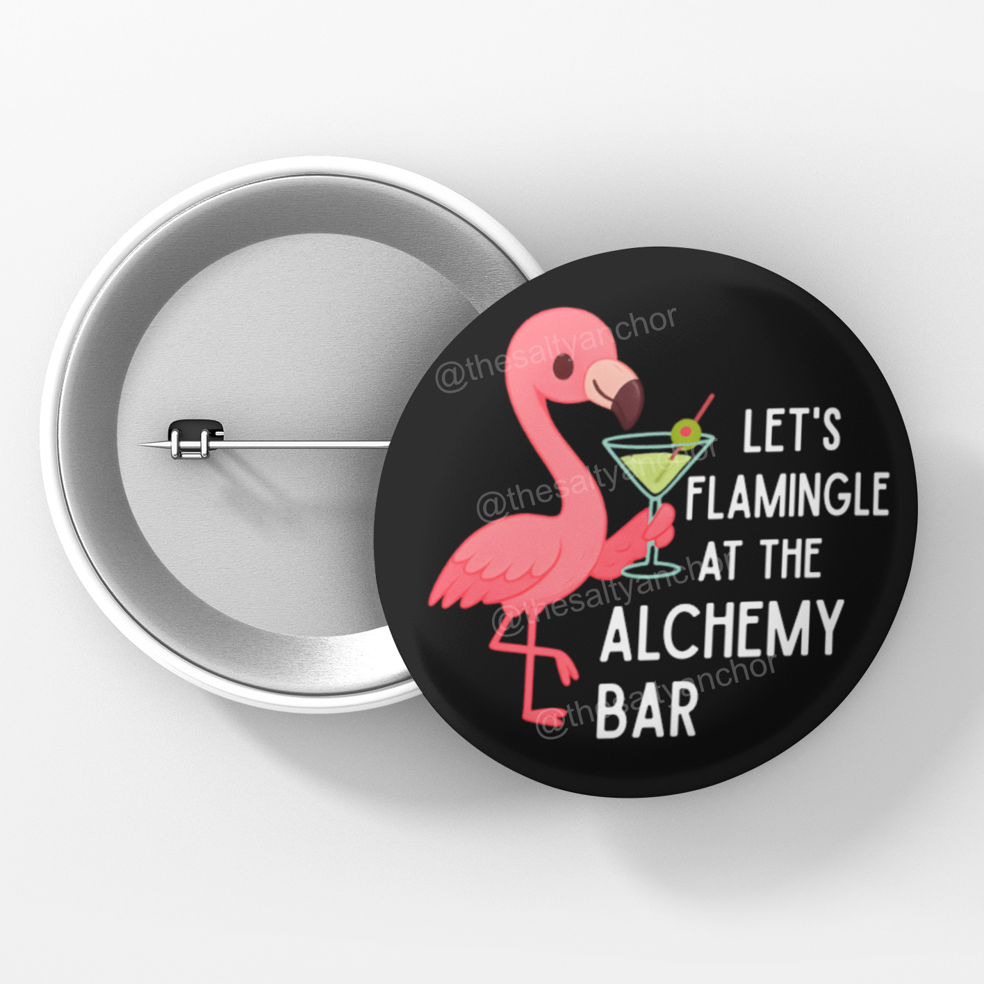 Button badge with a flamingo design and text 'Let's Flamingle at the Alchemy Bar' on a white background.