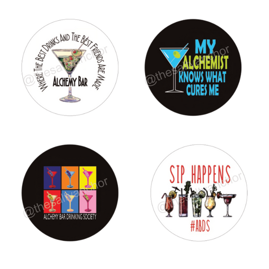 A set of six round drink coasters with various nautical-themed designs, including text and images related to alchemy and drinking society.