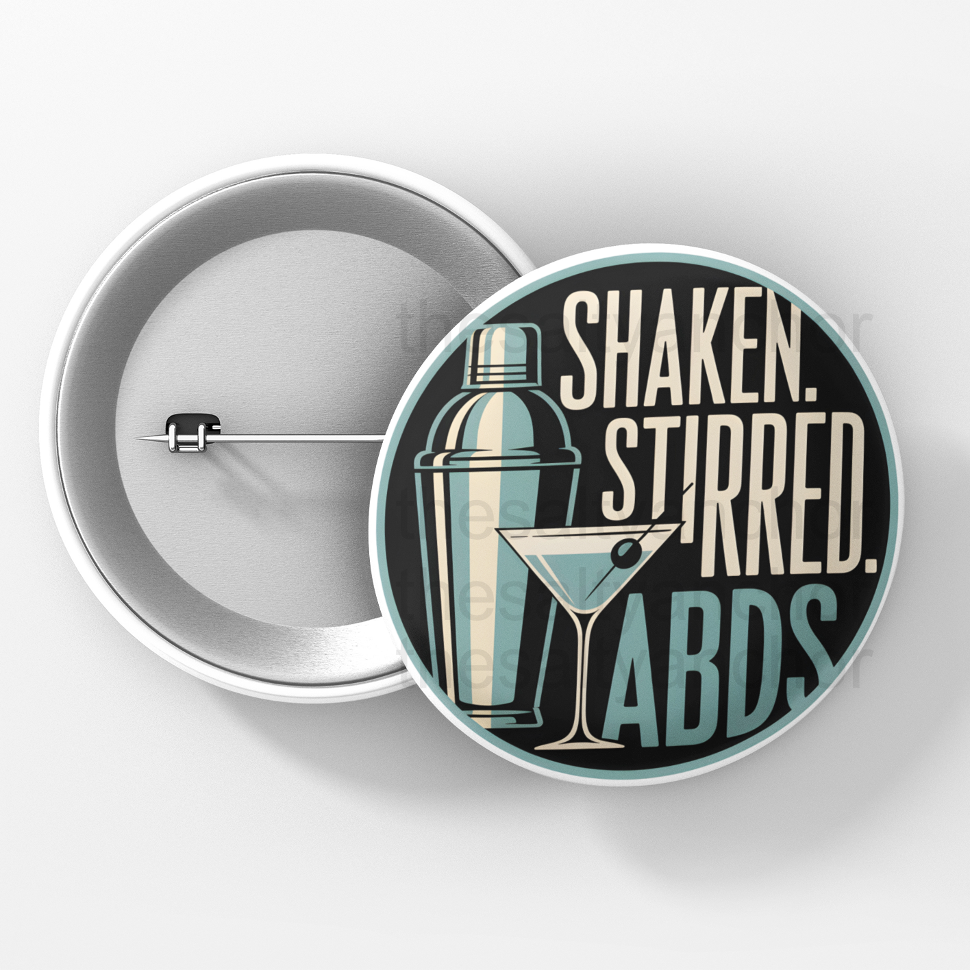 Button badge with cocktail-themed design and text 'Shaken. Stirred. ABDS.' on a white background