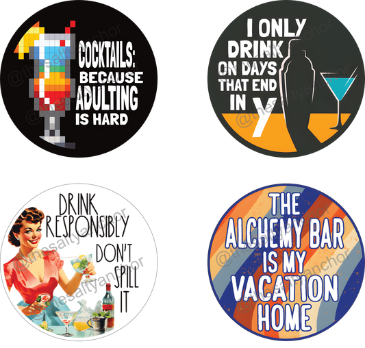 A set of six round coasters with various colorful designs related to the Alchemy Bar theme, such as a cartoon of a person drinking, and text phrases like 'ALCHEMY BAR DRINKING SOCIETY' and 'THE ALCHEMY BAR IS MY VACATION HOME'.