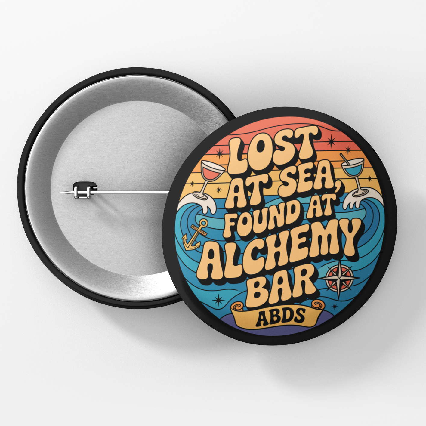 Button badge with 'Lost at Sea, Found at Alchemy Bar' text on a white background
